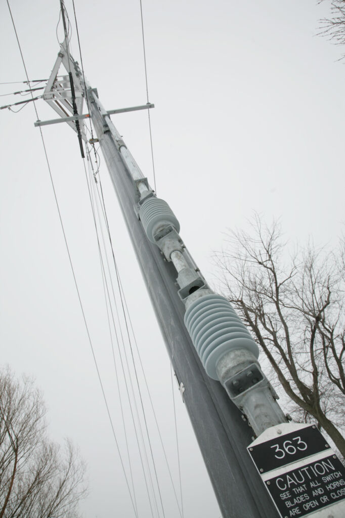 Trident composite pole transformer switch