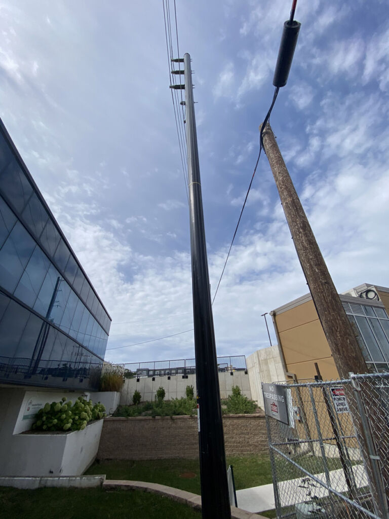 Trident single-layer composite pole in limited access small city area